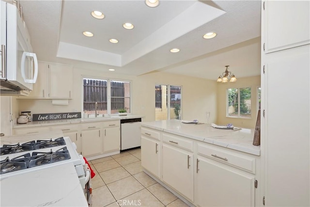 7605 Pasito Ave, Rancho Cucamonga, CA 91730 - kitchen featuring white appliances, recessed lighting, a chandelier, light tile patterned floors, and white cabinets