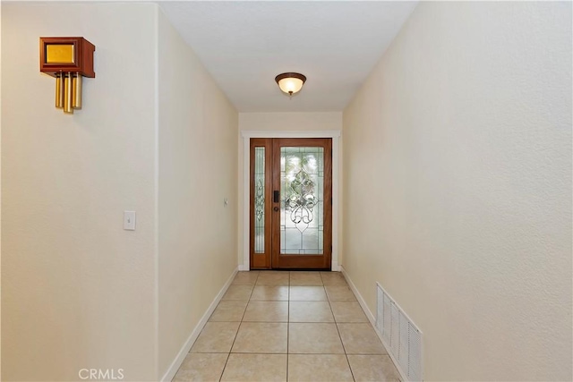7605 Pasito Ave, Rancho Cucamonga, CA 91730 - doorway with light tile patterned floors and baseboards