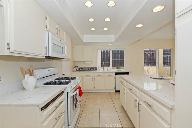 7605 Pasito Ave, Rancho Cucamonga, CA 91730 - kitchen featuring white appliances, recessed lighting, light tile patterned floors, white cabinets, and a sink