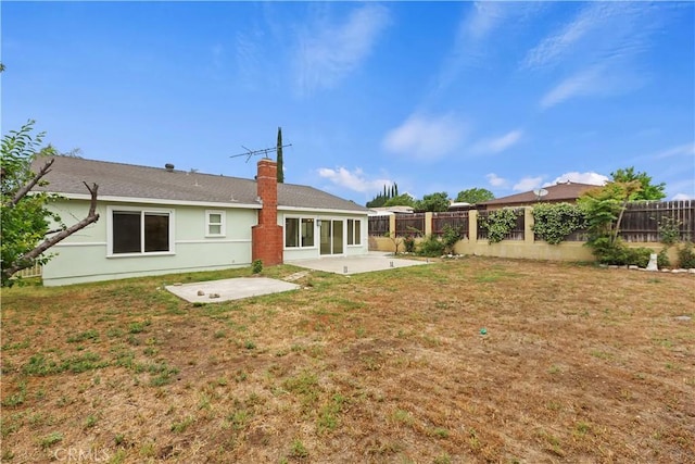 7605 Pasito Ave, Rancho Cucamonga, CA 91730 - rear view of house featuring a patio area, a chimney, and stucco siding