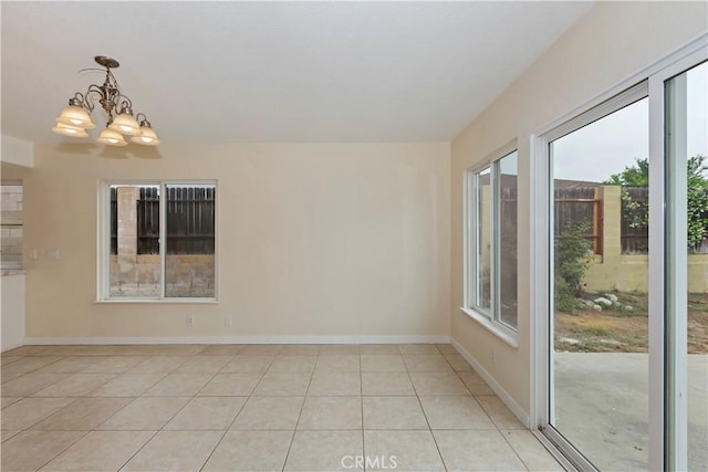7605 Pasito Ave, Rancho Cucamonga, CA 91730 - unfurnished room with a chandelier, light tile patterned floors, and baseboards