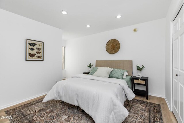 5354 Lindley Ave Unit 202, Encino, CA 91316 - bedroom featuring a closet, wood finished floors, recessed lighting, and baseboards