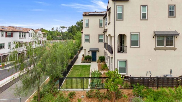 2328 Stardust Gln, Escondido, CA 92025 - back of house featuring stucco siding and a fenced backyard