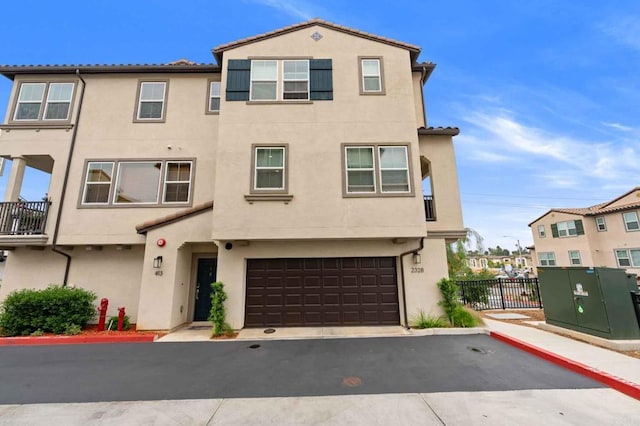 2328 Stardust Gln, Escondido, CA 92025 - view of property with stucco siding, a garage, a tiled roof, and asphalt driveway