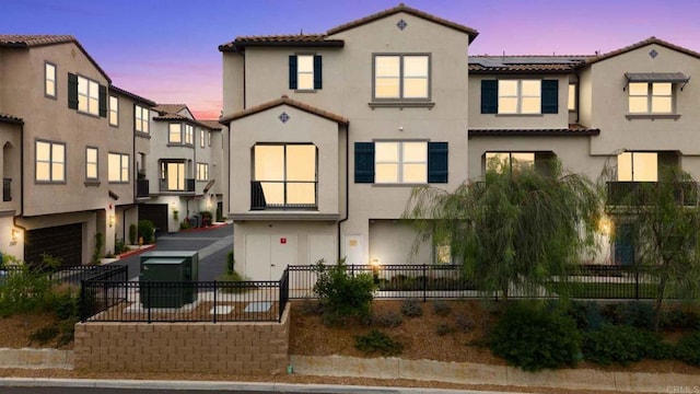 2328 Stardust Gln, Escondido, CA 92025 - view of front of home featuring a tile roof, stucco siding, solar panels, and a garage