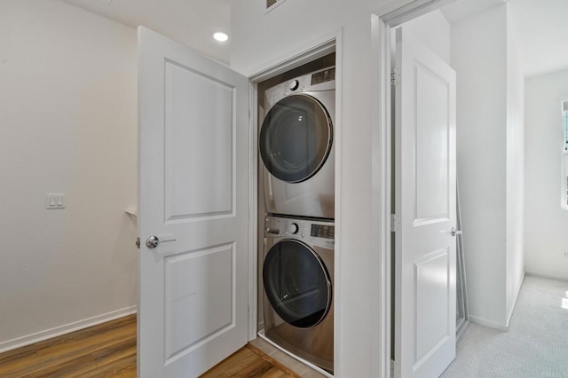 2328 Stardust Gln, Escondido, CA 92025 - laundry area with stacked washing machine and dryer, recessed lighting, and wood finished floors