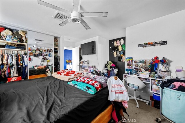 18251 Hiawatha Rd, Apple Valley, CA 92307 - carpeted bedroom with a ceiling fan and a closet
