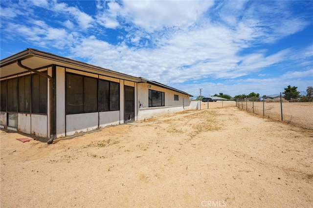 18251 Hiawatha Rd, Apple Valley, CA 92307 - rear view of property featuring a sunroom