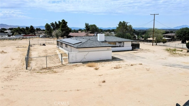 18251 Hiawatha Rd, Apple Valley, CA 92307 - view of home's exterior with solar panels and a mountain view