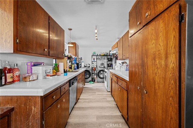 18251 Hiawatha Rd, Apple Valley, CA 92307 - kitchen featuring white gas stove, dishwasher, light wood finished floors, backsplash, and rail lighting