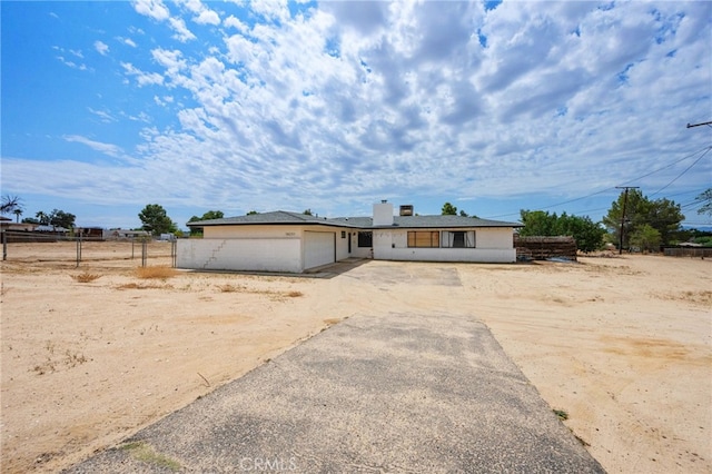 18251 Hiawatha Rd, Apple Valley, CA 92307 - view of front of property with an attached garage and dirt driveway