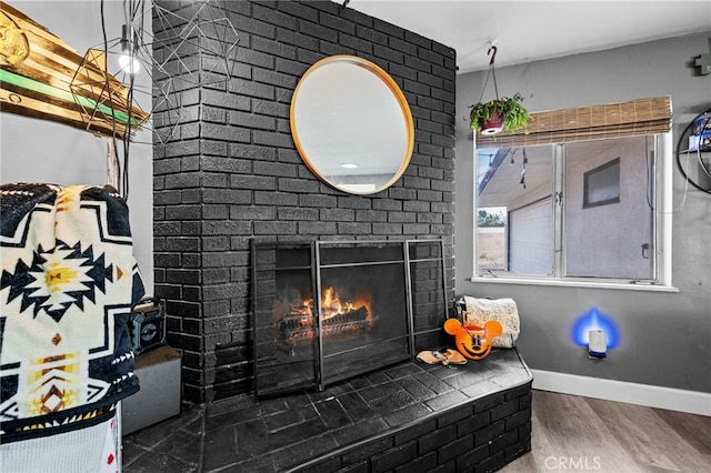18251 Hiawatha Rd, Apple Valley, CA 92307 - detailed view of wood finished floors, a fireplace, and baseboards