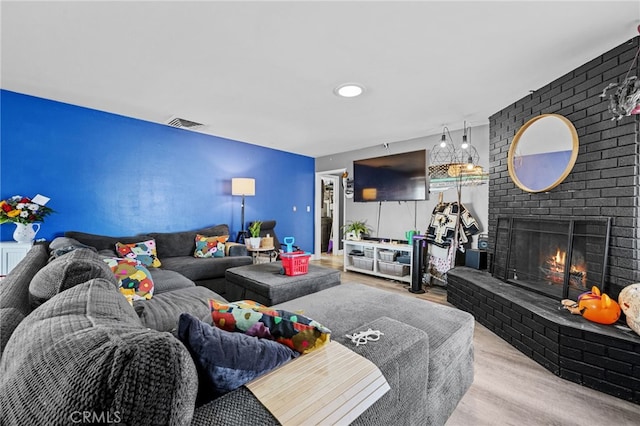 18251 Hiawatha Rd, Apple Valley, CA 92307 - living room with wood finished floors and a fireplace