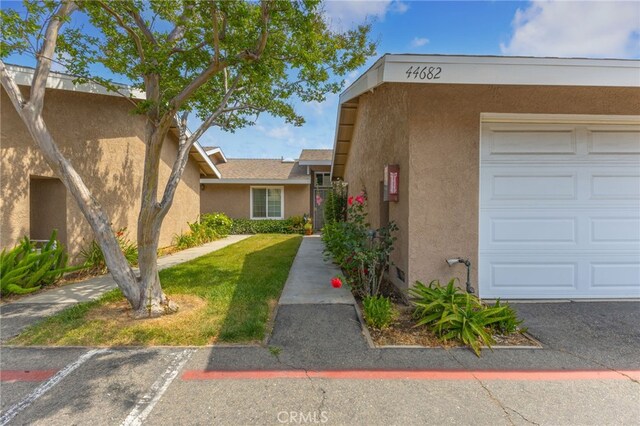 44682 La Paz Rd, Temecula, CA 92592 - view of property featuring a garage and uncovered parking
