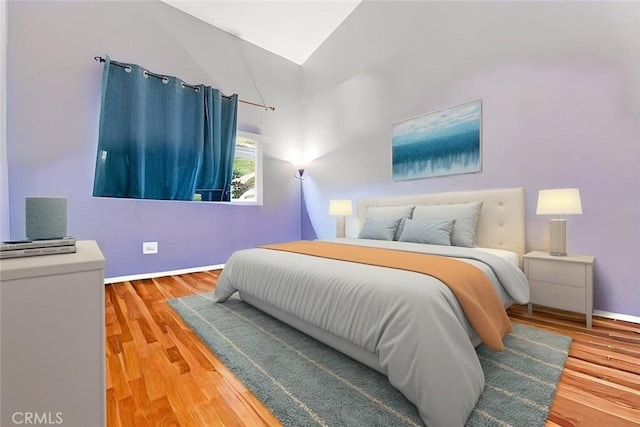 44682 La Paz Rd, Temecula, CA 92592 - bedroom featuring wood finished floors and vaulted ceiling