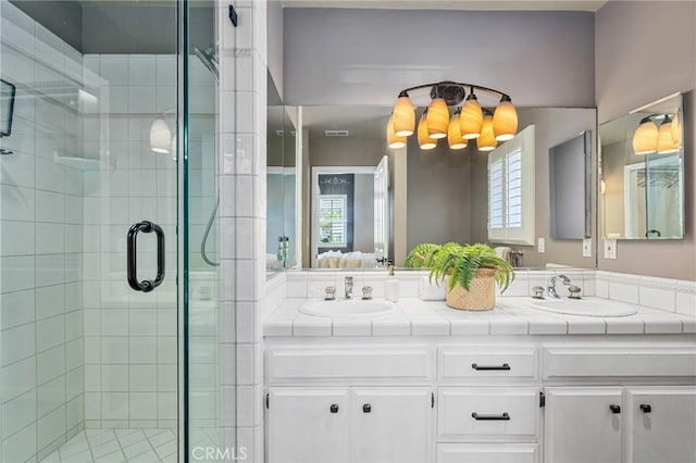 2645 S Patton Ave, San Pedro, CA 90731 - bathroom with a stall shower, double vanity, plenty of natural light, and ensuite bath