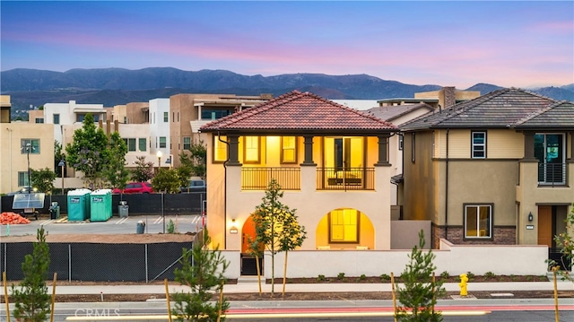149 Great Park Blvd, Irvine, CA 92618 - view of front of property with a balcony, a mountain view, stucco siding, and a tile roof