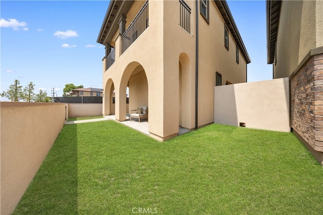 149 Great Park Blvd, Irvine, CA 92618 - view of yard featuring a patio area and a balcony