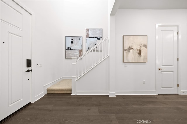 149 Great Park Blvd, Irvine, CA 92618 - entryway featuring dark wood-style floors, baseboards, and stairs