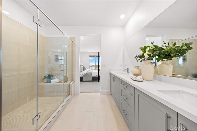 149 Great Park Blvd, Irvine, CA 92618 - ensuite bathroom with double vanity, tile patterned floors, a shower stall, and recessed lighting