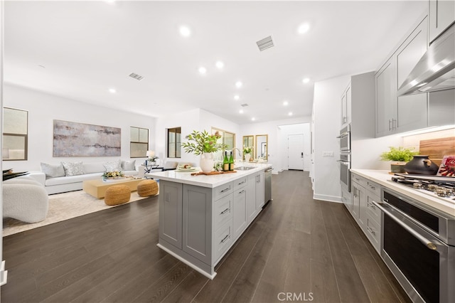149 Great Park Blvd, Irvine, CA 92618 - kitchen with under cabinet range hood, gray cabinets, light countertops, and recessed lighting