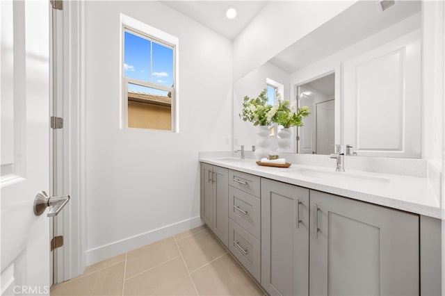 149 Great Park Blvd, Irvine, CA 92618 - bathroom featuring double vanity, plenty of natural light, baseboards, and tile patterned floors