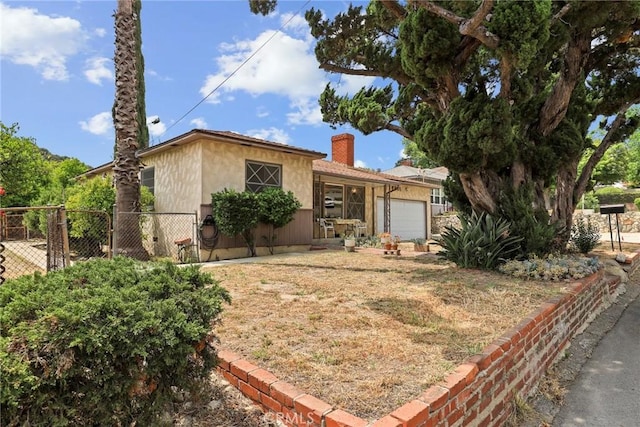 9241 Pali Ave, Tujunga, CA 91042 - ranch-style home with a chimney and a garage