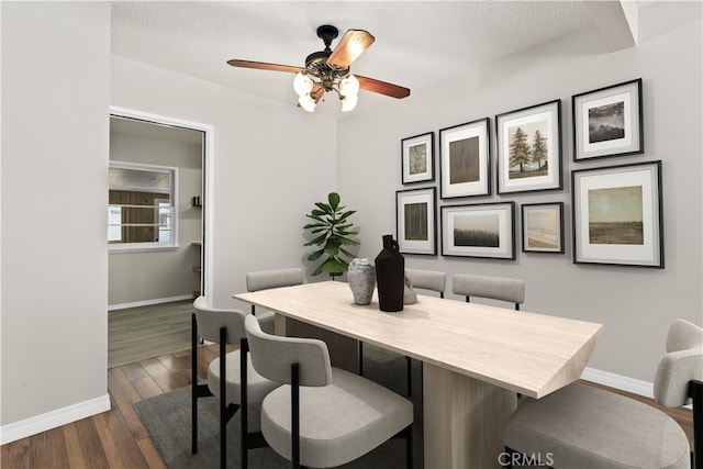 9241 Pali Ave, Tujunga, CA 91042 - dining room featuring baseboards, a ceiling fan, dark wood-style floors, and a textured ceiling