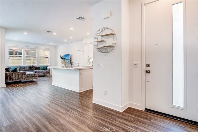 261 Siena, Lake Forest, CA 92630 - kitchen featuring open floor plan, dark wood-style flooring, white cabinetry, light countertops, and baseboards