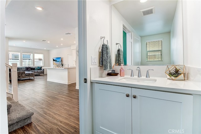 261 Siena, Lake Forest, CA 92630 - bathroom featuring vanity, wood finished floors, and recessed lighting