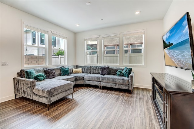 261 Siena, Lake Forest, CA 92630 - living room featuring wood finished floors, baseboards, and recessed lighting