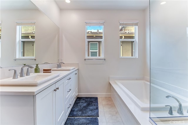 261 Siena, Lake Forest, CA 92630 - full bath with double vanity, healthy amount of natural light, a bath, tile patterned flooring, and recessed lighting