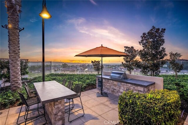 261 Siena, Lake Forest, CA 92630 - patio terrace at dusk with a bar and a patio