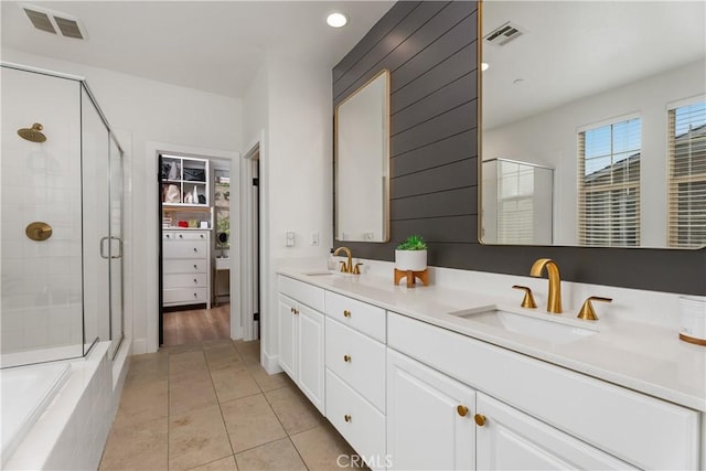 40 Lomada St, Rancho Mission Viejo, CA 92694 - bathroom with a shower stall, double vanity, tile patterned floors, recessed lighting, and a walk in closet