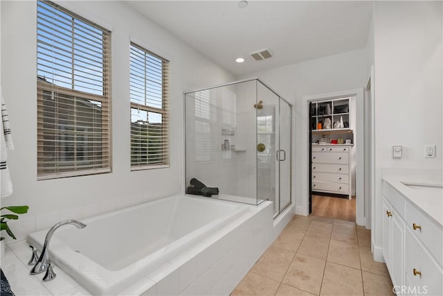 40 Lomada St, Rancho Mission Viejo, CA 92694 - full bathroom with a garden tub, a shower stall, vanity, tile patterned flooring, and recessed lighting