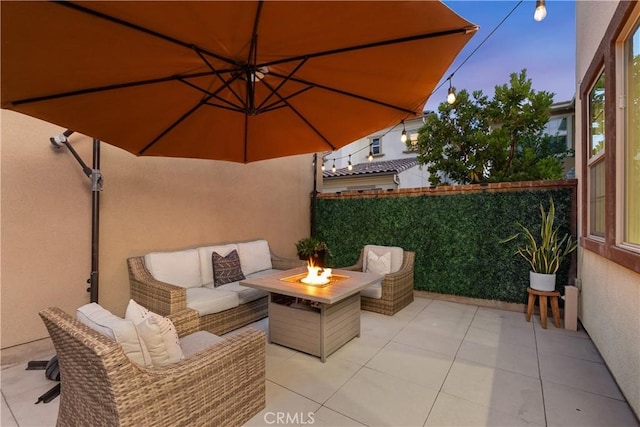 40 Lomada St, Rancho Mission Viejo, CA 92694 - patio terrace at dusk featuring a patio area and an outdoor living space with a fire pit