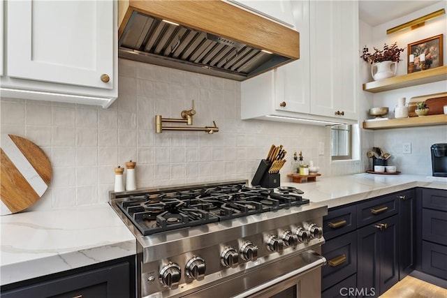 40 Lomada St, Rancho Mission Viejo, CA 92694 - kitchen with custom range hood, stainless steel range, white cabinetry, and light stone countertops