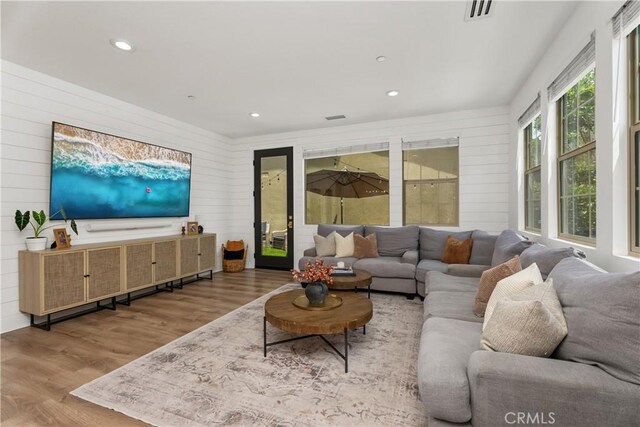 40 Lomada St, Rancho Mission Viejo, CA 92694 - living area with wood finished floors, wood walls, and recessed lighting
