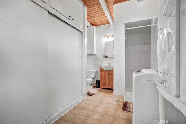 3224 Cerritos Ave, Signal Hill, CA 90755 - full bathroom featuring wooden ceiling, stacked washer / drying machine, a shower, and vanity