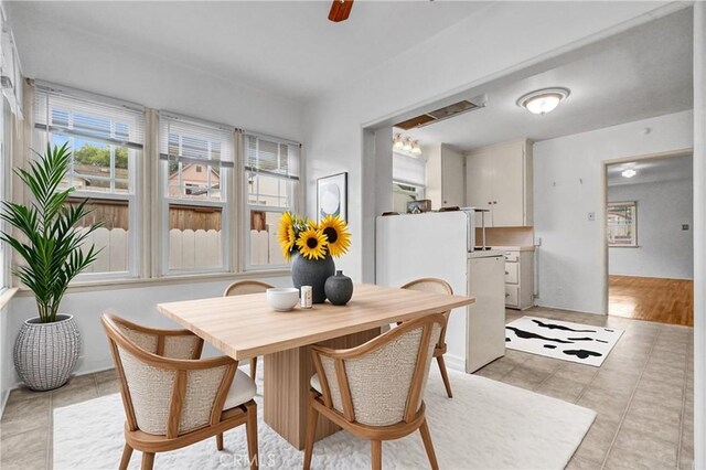 3224 Cerritos Ave, Signal Hill, CA 90755 - dining area featuring light tile patterned flooring and ceiling fan