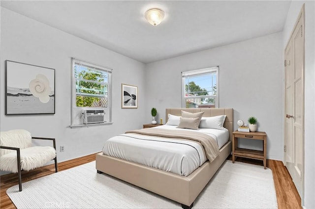 3224 Cerritos Ave, Signal Hill, CA 90755 - bedroom with cooling unit, multiple windows, and light wood-type flooring