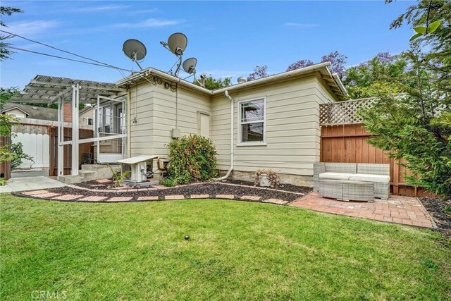 3224 Cerritos Ave, Signal Hill, CA 90755 - back of house with a patio area, a pergola, and an outdoor living space