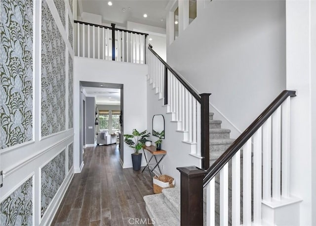 23942 Schoenborn St, West Hills, CA 91304 - foyer featuring a high ceiling, wood finished floors, stairway, recessed lighting, and wallpapered walls
