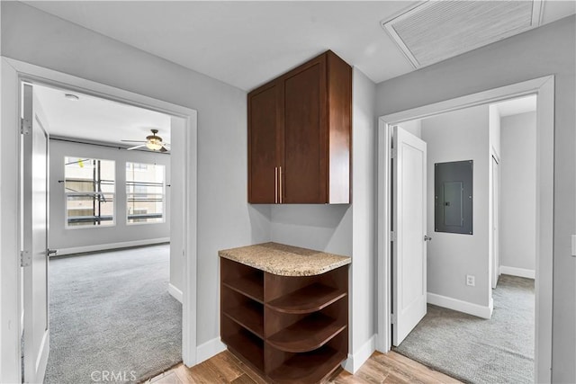 300 E 4th St Unit 204, Long Beach, CA 90802 - hall with electric panel, baseboards, light carpet, and light wood-style flooring
