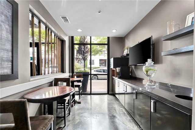 300 E 4th St Unit 204, Long Beach, CA 90802 - kitchen featuring open shelves, concrete flooring, dark countertops, recessed lighting, and dark cabinets