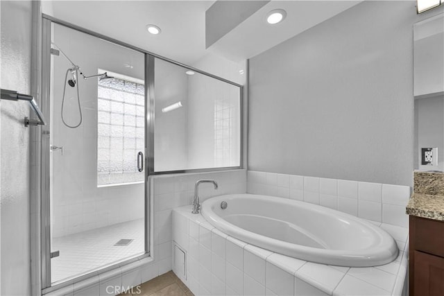 300 E 4th St Unit 204, Long Beach, CA 90802 - full bath with vanity, a bath, a shower stall, recessed lighting, and tile patterned flooring