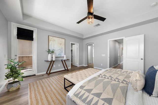 1686 Pember Ave, Chula Vista, CA 91913 - bedroom with wood finished floors, a tray ceiling, and a ceiling fan