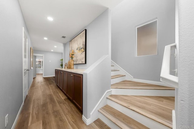 1686 Pember Ave, Chula Vista, CA 91913 - corridor with wood finished floors, stairway, and recessed lighting