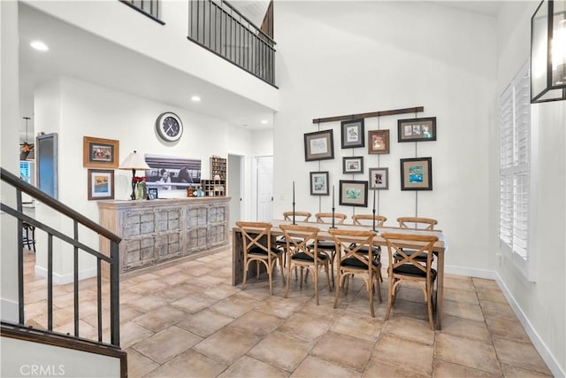 32811 Wesley St, Wildomar, CA 92595 - dining area featuring a high ceiling, baseboards, and stone finish floors