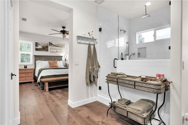 32811 Wesley St, Wildomar, CA 92595 - bedroom with wood-type flooring, multiple windows, and baseboards